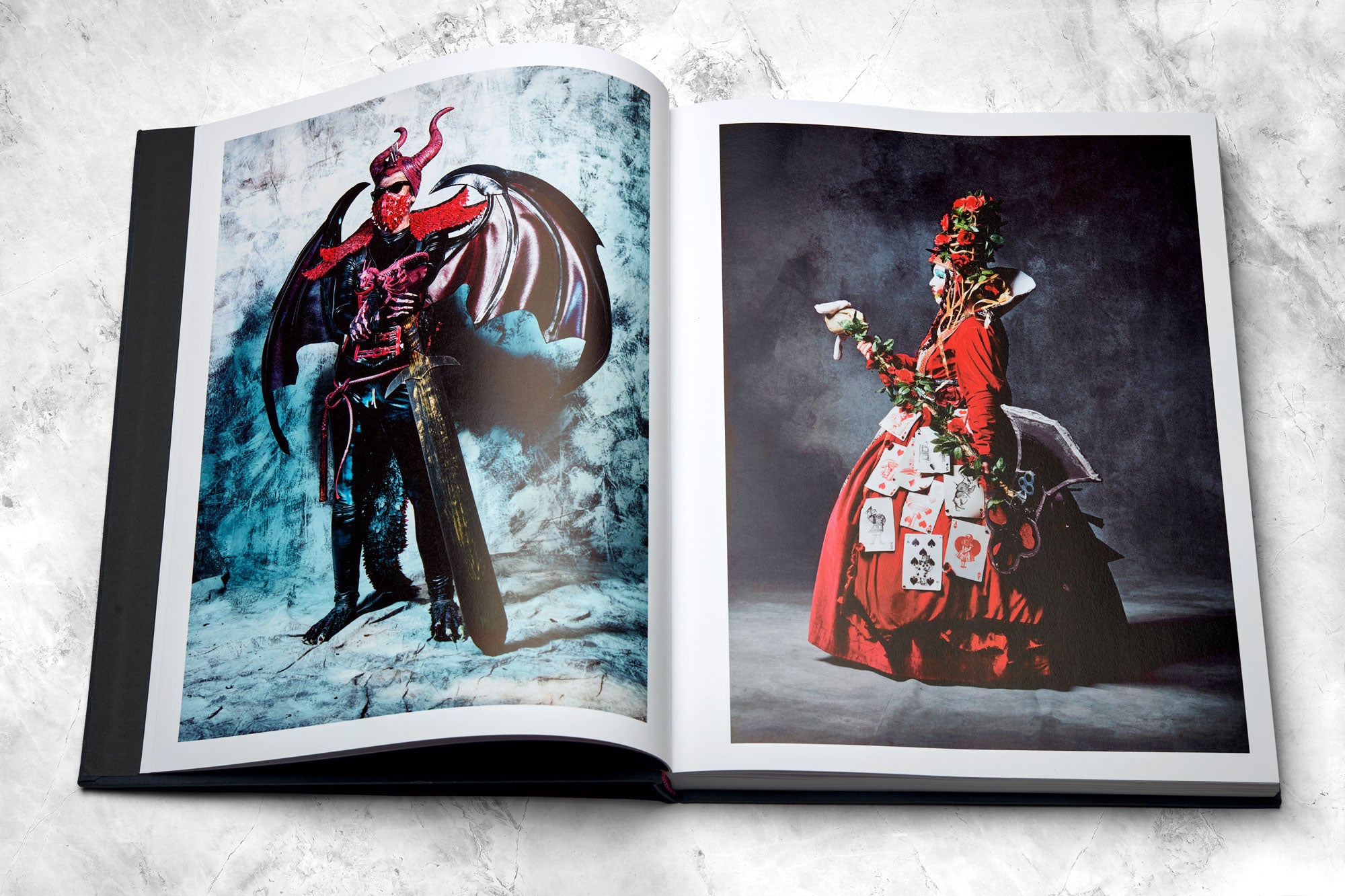 Mayflies book open spread of portraits in a studio environment, left: a costumed heavy metal demoness from Wave Gotik Triffin and a Queen of Hearts cosplayer from MCM Comic Comic